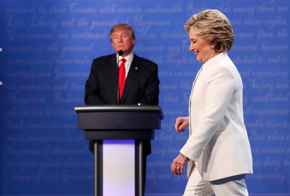 Image: Democratic U.S. presidential nominee Clinton walks off the debate stage as Republican U.S. presidential nominee Trump remains at his podium after the conclusion of their third and final 2016 presidential campaign debate in Las Vegas