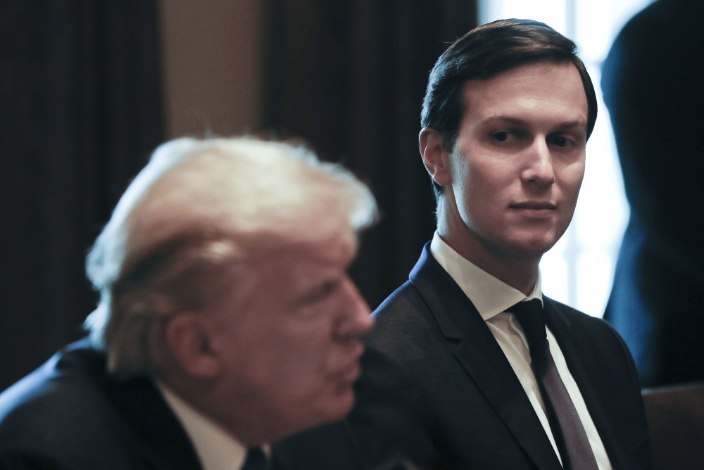 Image: White House Senior Adviser and envoy, Jared Kushner, listens as President Donald Trump speaks during a meeting in the Cabinet Room of the White House