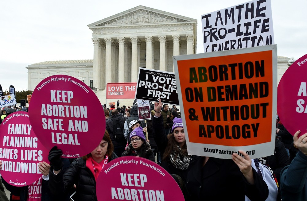 Pro-choice and pro-life activists demonstrate in front of the the Supreme Court during the 47th annual March for Life on Jan. 24, 2020.