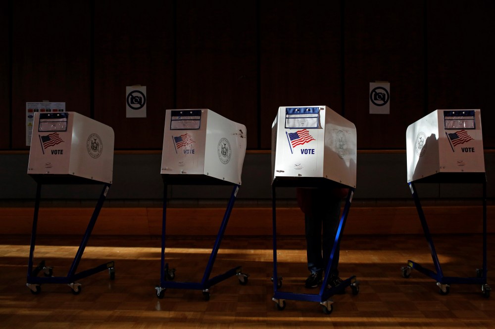 Image: A voter fills out a ballot at a Harlem community center in New York on Nov. 8, 2016.