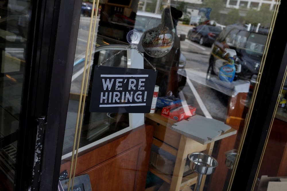 Image: A "We're Hiring" sign advertising jobs is seen at the entrance of a restaurant, as Miami-Dade County eases some of the lockdown measures put in place during the coronavirus disease (COVID-19) outbreak, in Miami