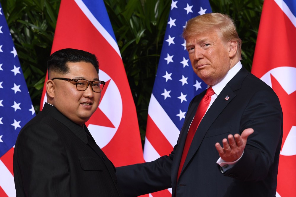 Image: President Donald Trump gestures as he meets with North Korea's leader Kim Jong Un at the start of their historic U.S.-North Korea summit at the Capella Hotel on Sentosa island in Singapore