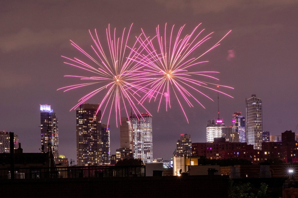 Image: Illegal fireworks illuminate the sky over the Bedford-Stuyvesant neighborhood of the Brooklyn borough of New York City, New York