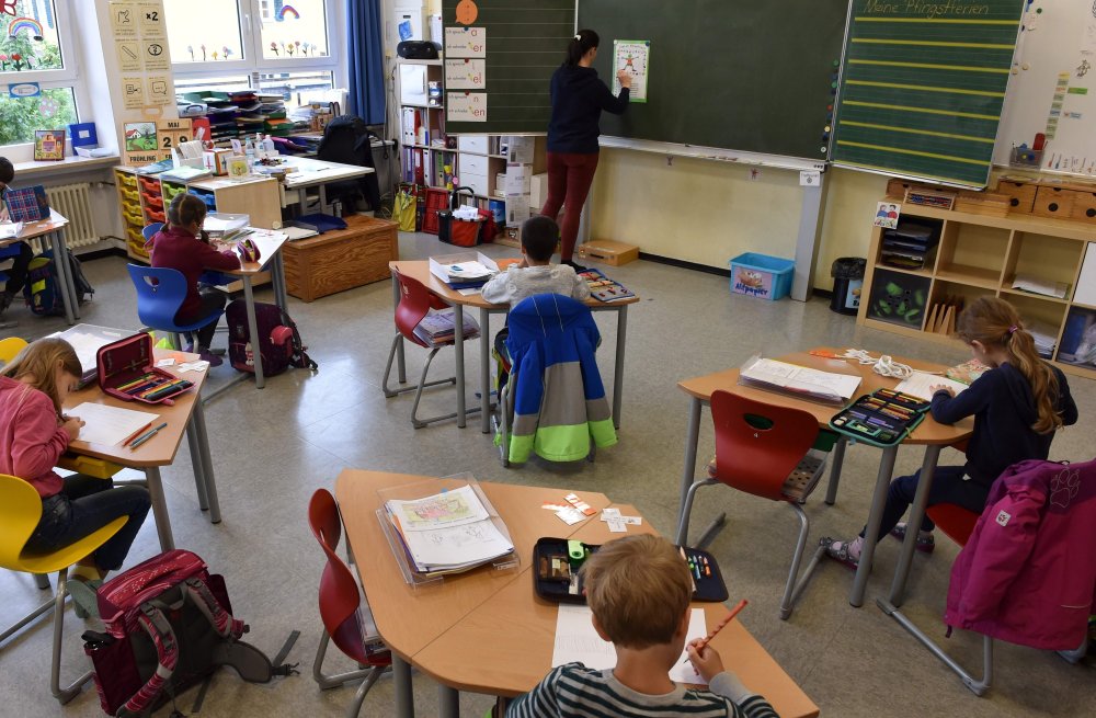 Image: Students sit in a classroom at a primary school in Eichenau, southern Germany,