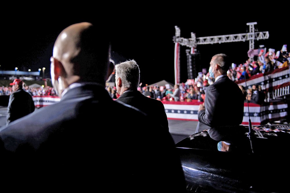 Secret Service members and others listen while President Donald Trump speaks in Hickory, N.C., on Nov.  1, 2020.