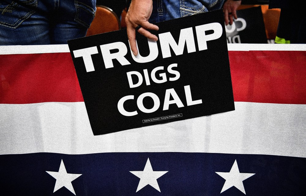 Image: A supporter of President Donald Trump holds a sign that reads "Trump Digs Coal" a rally in Charleston, W.V., on Aug. 21, 2018.