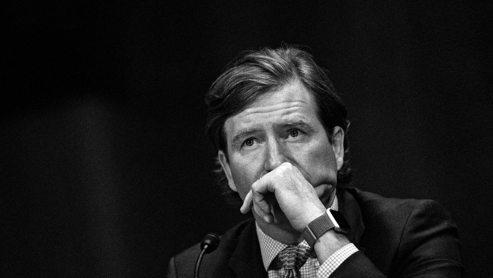 Image: Chris Krebs listening at a Senate Judicial Committee hearing