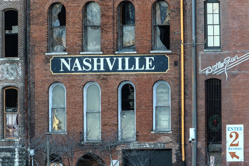 Image: A building in Nashville with broken glass windows after an explosion.