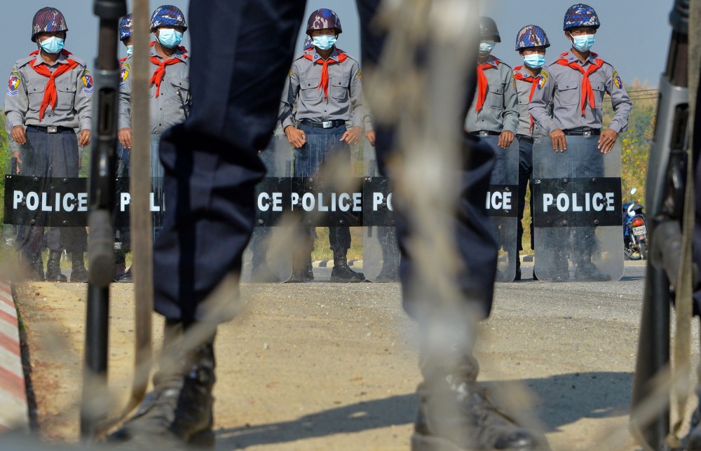 Image: Police wearing stand guard in Naypyidaw, Myanmar.
