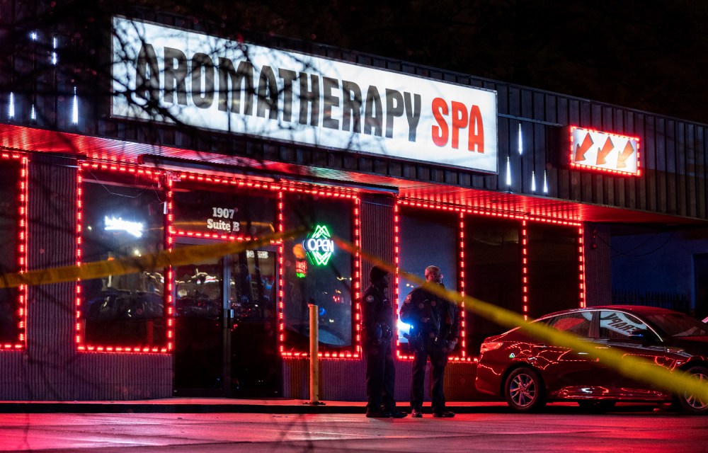 Image: Police officers outside a message parlor that has a sign that reads,"Aromatherapy Spa" in Atlanta, Georgia.