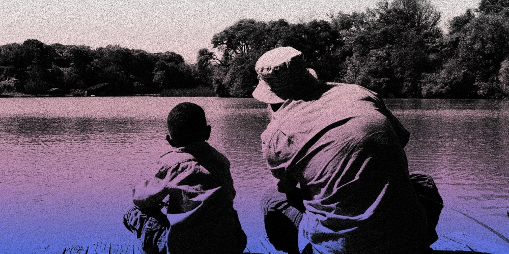 Image: Father and son looking at a lake.