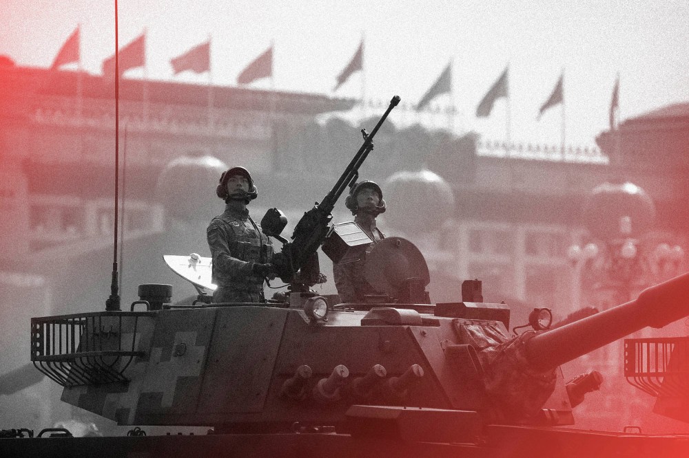 Image: Tank crew members stand at attention during a parade commemorating the 70th anniversary of Communist China in Beijing in 2019.