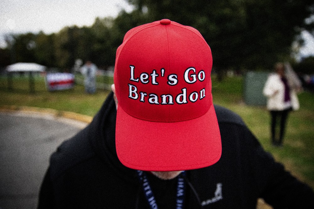 Image: A supporter of former President Donald Trump wears a "Let's Go Brandon" hat before a campaign event in Arlington, Va., on Oct. 26, 2021.