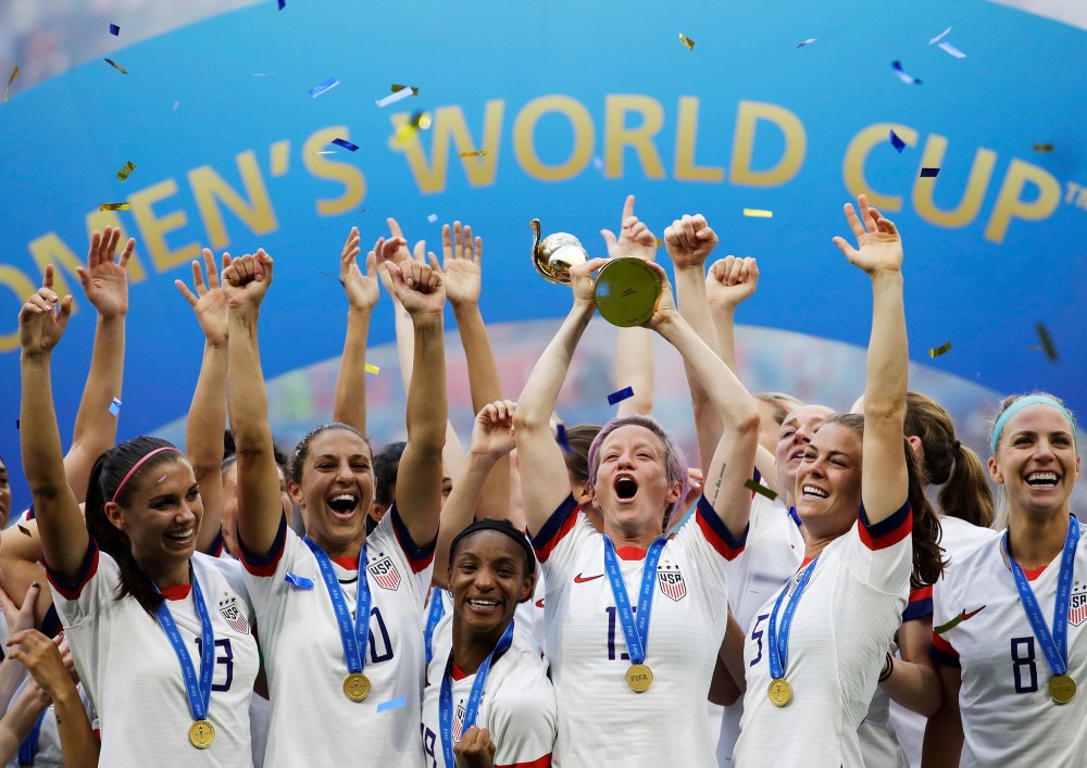 Megan Rapinoe lifts up the trophy after winning the Women's World Cup final soccer match at the Stade de Lyon in Decines, outside Lyon, France, on July 7, 2019.