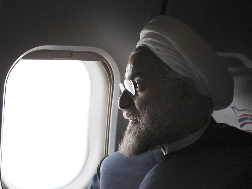 In this Monday, June 10, 2013, Iranian President, Hasan Rouhani, a former Iran's top nuclear negotiator, looks on, in his plane, during his presidential election campaign tour to the northwestern, Iran.  (Photo by Vahid Salemi/AP)