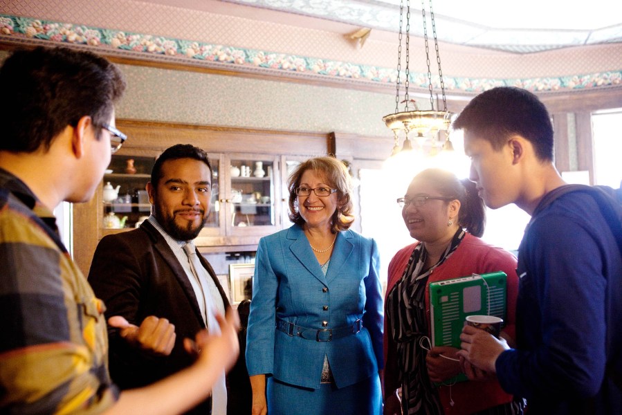 Eloise Gomez Reyes (center) talks to campaign volunteers at her law office, which is currently acting as her campaign headquarters, in Colton, CA on Feb. 11, 2014.