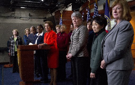 File photo: House Minority Leader Nancy Pelosi of Calif., center, accompanied by fellow House Democrats, leads a news conference on Capitol Hill in Washington, Wednesday, Jan. 23, 2013, to discuss the reintroduction of the Violence Against Women Act. ...