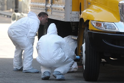 BOSTON, MA - APRIL 17: FBI crime scene investigators search a truck left on Boylston Street just past Berkeley Street April 17, 2013 in Boston, Massachusetts.  Investigators continue to work the scene of two bomb explosions at the finish line of the...