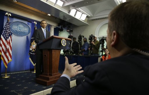 President Barack Obama listens to a question from NBC's White House correspondent Chuck Todd, seated, right, during his new conference in the Brady Press Briefing Room of the White House in Washington, Tuesday, April 30, 2013. (Photo by: Evan Vucci/AP...
