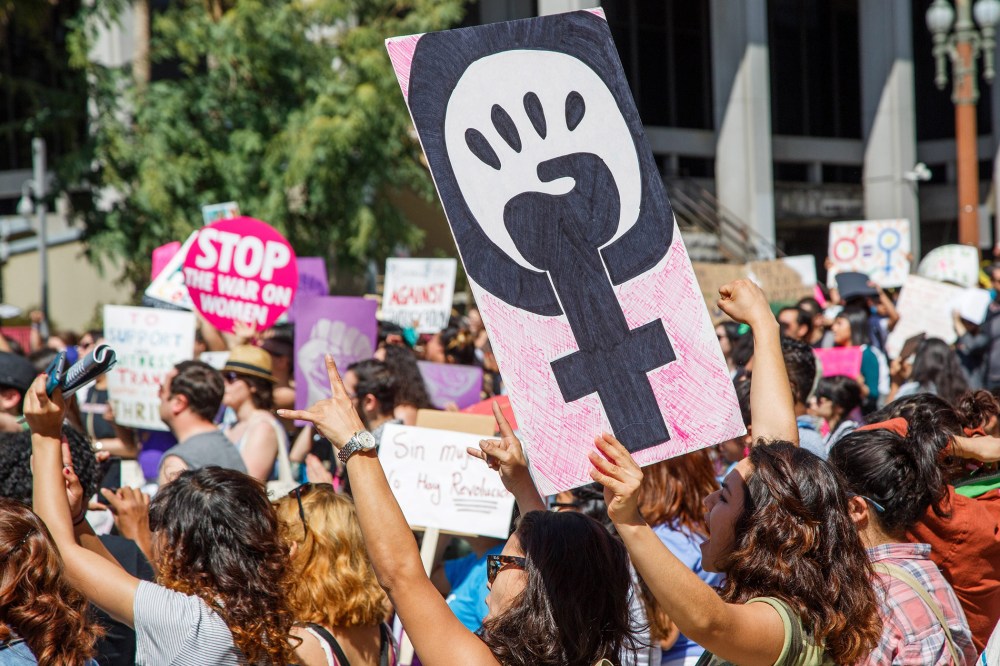 Protesters attend a march for equal rights and justice to mark International Women's Day, in downtown Los Angeles, Calif. on March 8, 2015. (Photo by Eugene Garcia/EPA)