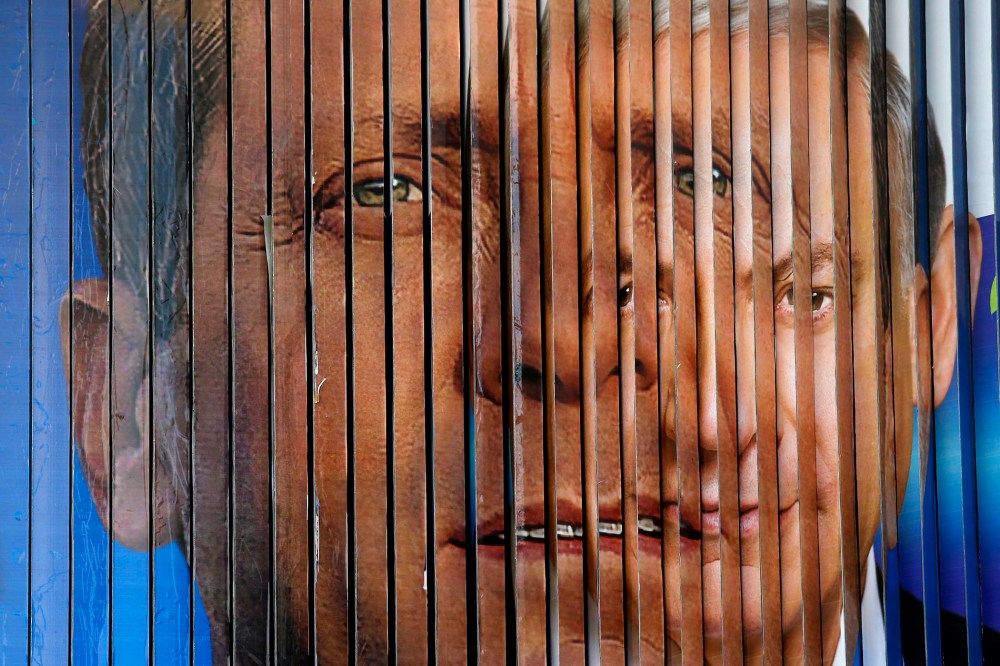 A rotating billboard that shows the faces of the two candidates for Israel's prime minister, incumbent Benjamin Netanyahu (R) and opposition leader Yitzhak Herzog, in Tel Aviv, Israel on March 12, 2015.