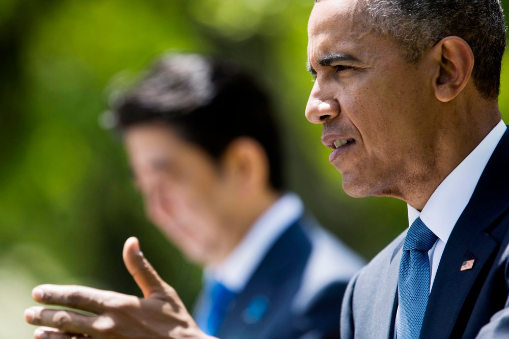 US President Barack Obama (R) speaks at a joint press conference with Shinzo Abe (L), Prime Minister of Japan, in the Rose Garden of the White House in Washington DC on April 28, 2015.