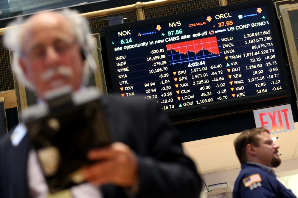 Traders work on the floor of the New York Stock Exchange (NYSE) near the end of the trading day in New York, N.Y., Aug. 21, 2015. (Photo by Andrew Gombert/EPA)