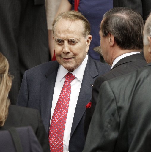 File Photo: Former Sen. Bob Dole, R-Kan., leaves the memorial service for Jack Kemp at National Cathedral in Washington, Friday, May 8, 2009. (Photo by: J. Scott ApplewhiteAP Photo)
