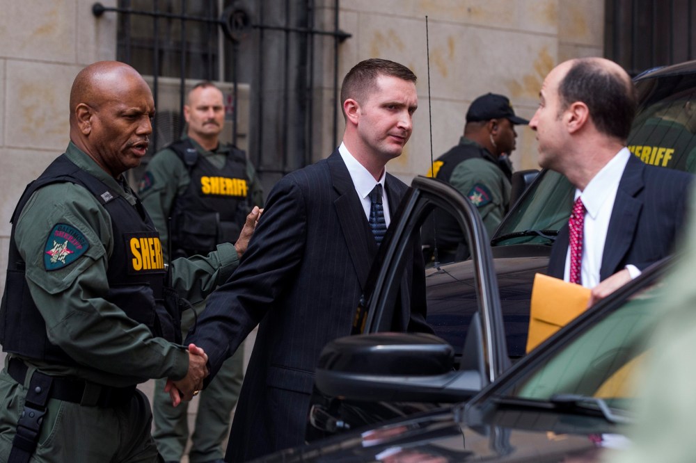 Baltimore police officer Edward Nero, along with his attorney Marc Zayon, leaves the courthouse after being acquitted of all charges in the death of Freddie Gray in Baltimore, Md., May 23, 2016. (Photo by Jim Lo Scalzo/EPA)