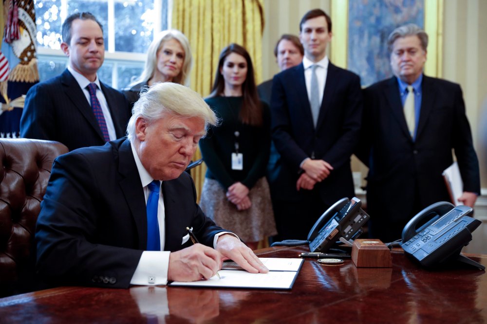 Image: US President Trump signs executive order to allow Dakota,. Keystone pipelines