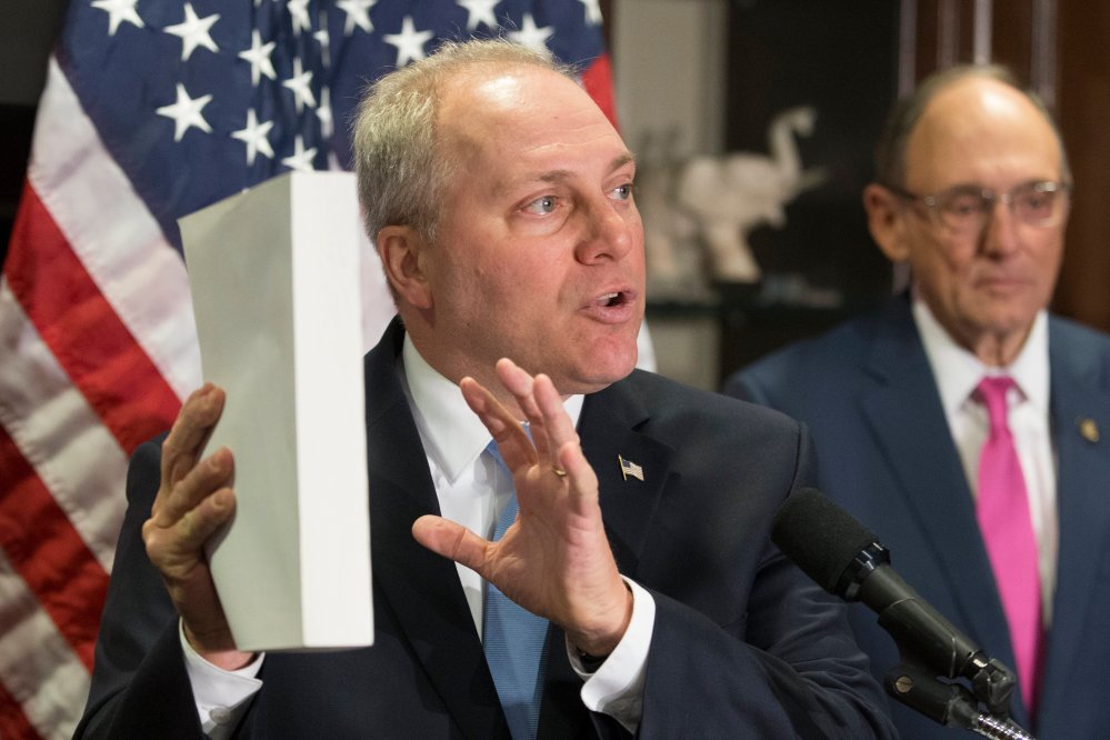 (FILE) Republican Representative from Louisiana Steve Scalise holds a copy of the Affordable Care Act, also known as 'Obamacare', during a news conference held by House Republican leadership, March 8, 2017.