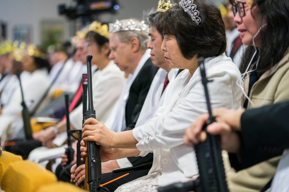 Parishioners with the Sanctuary Church hold onto their AR-15s, which churchgoers were encouraged to bring to a blessing ceremony to rededicate their marriages, at the World Peace and Unification Sanctuary in Newfoundland, Pennsylvania, USA, 28 February 20