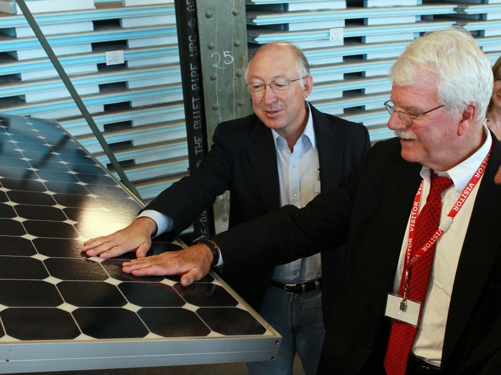 File Photo:  U.S. Secretary of the Interior Ken Salazar (L) and U.S. Rep. George Miller (D-CA) touch a solar panel as they tour Sunpower Corporation's research and development facility October 14, 2010 in Richmond, California. Salazar signed a Record...
