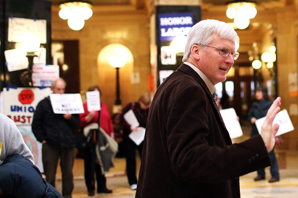 Republican Wisconsin State Senator Glenn Grothman waves as he walks through the Wisconsin State Capitol on March 4, 2011 in Madison,Wisconsin.