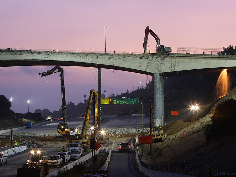 Workers demolish the south side of Mulholland overpass on the 405 freeway during the 53-hour total freeway closure resulting in massive traffic disruptions expected throughout the region on July 16, 2011 in Los Angeles, California. (Photo by David...