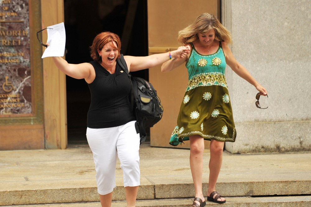 Wendy Torrington (L) and Kimberly Moreno (R) of Long Beach, Mississippi, celebrate being the first same-sex couple to obtain a marriage license at Manhattan's City Clerk's Office July 24, 2011 in New York.