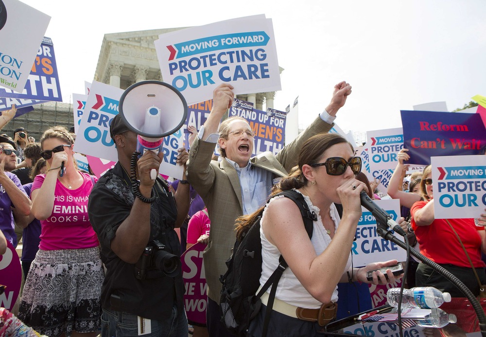 Supporters of the Affordable Healthcare Act celebrate in front of the Supreme Court after the court upheld the legality of the law in Washington June 28, 2012.