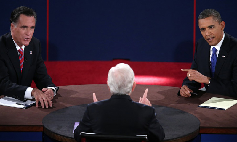 President  Barack Obama and Republican presidential candidate Mitt Romney both make a point as moderator Bob Schieffer gestures during the third presidential debate on October 22 at Lynn University in Boca Raton, Fla.  (Photo: Win MacNamee/AFP/Getty...