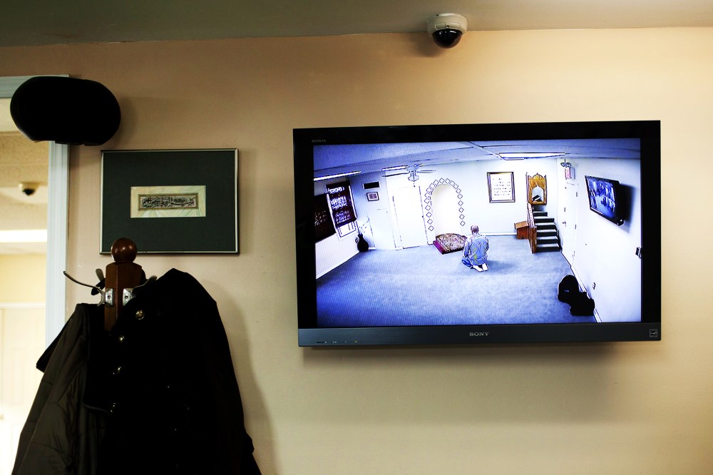 A CCTV monitor displays a man praying at the Iqra Masjid in Brooklyn, New York, Feb. 25, 2012.