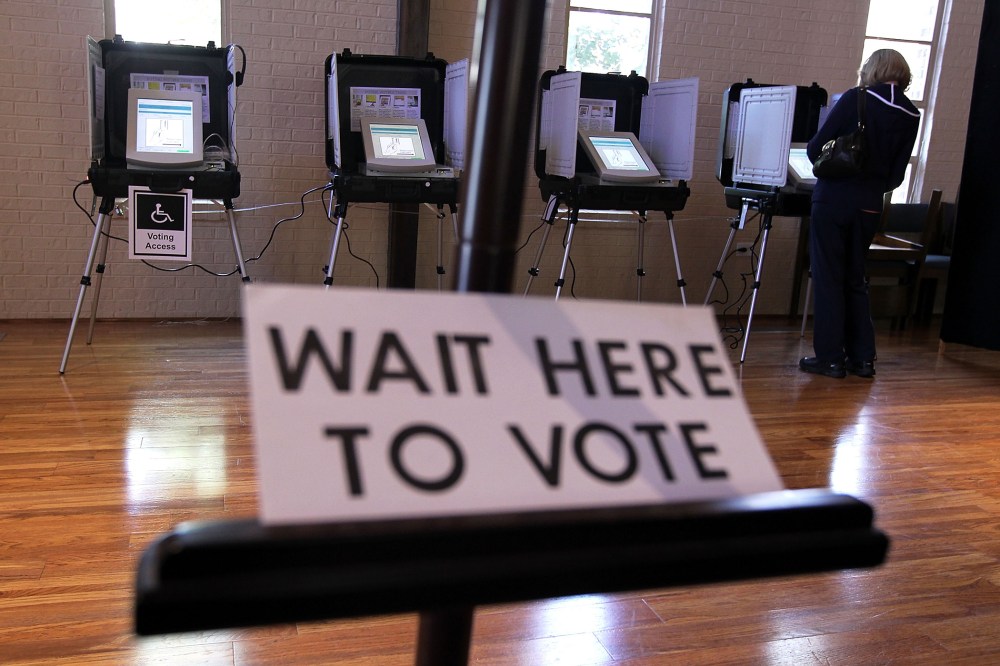 A local resident casts her vote at a polling station in St Andrew Presbyterian Church March 6, 2012 in Sandy Springs, Georgia.