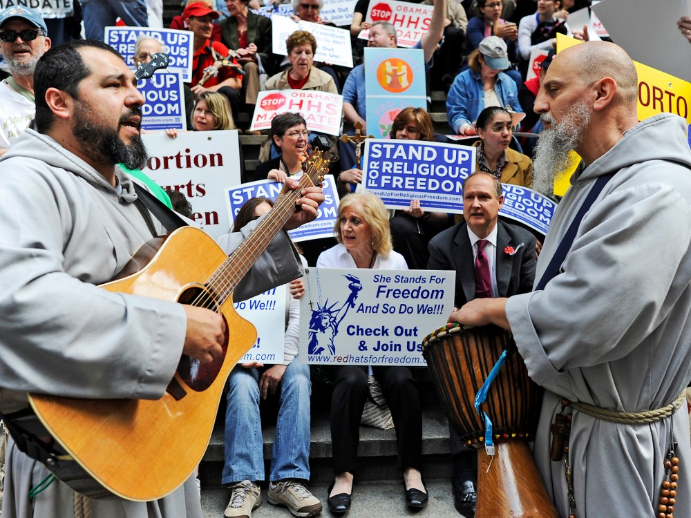 Demonstrators protest during a "Stand Up for Religious Freedom" rally, at Federal Hall National Memorial in New York on March 23, 2012.