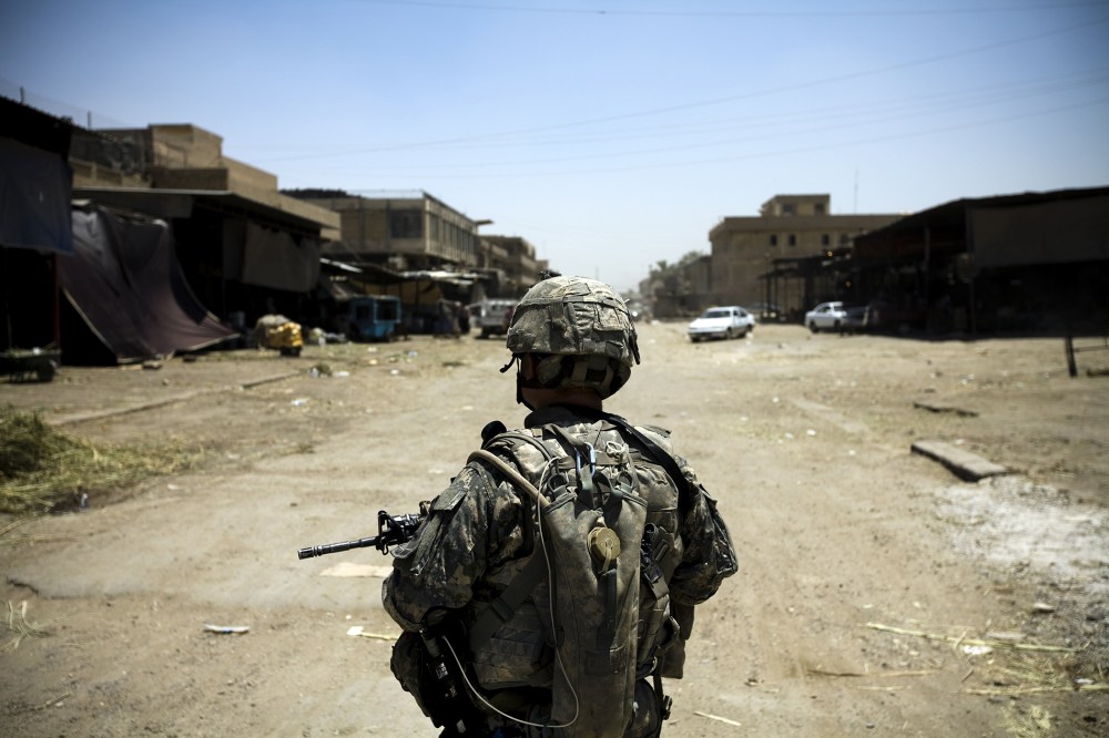 An American soldier on patrol in Jamilla Market on July 15 2008 in Sadr City, Iraq. (Photo by Benjamin Lowy/ Getty)
