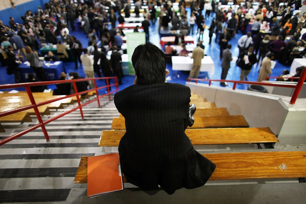 A man takes a break from at a job fair, May 3, 2012, in New York, N.Y.