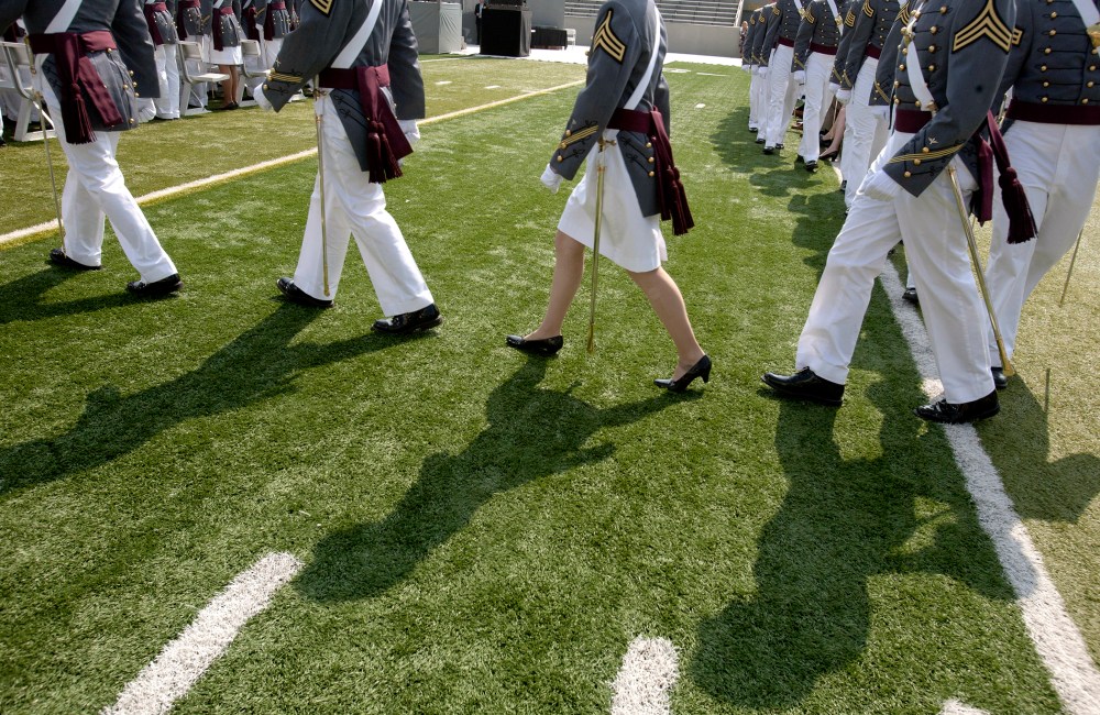 Cadets of The United States Military Academy walk to their seats for a graduation and commissioning ceremony May 26, 2012 in West Point, New York.