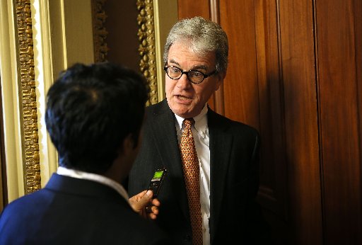 Sen. Tom Coburn (R-OK) speaks to a journalist at the U.S. Capitol September 19, 2012 in Washington, DC. (Photo by Alex Wong/Getty Images)