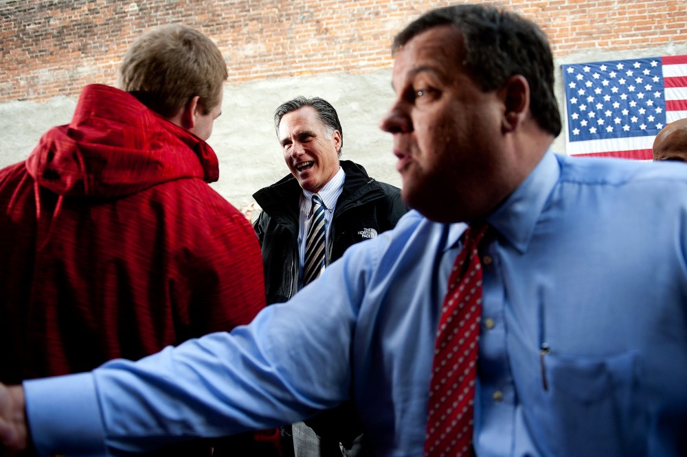 Mitt Romney and Chris Christie talk with supporters in Delaware, Ohio, October 10, 2012.
