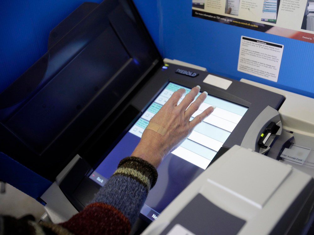 File Photo: A ballot is filled using an electronic voting machine November 6, 2012 in Portage, Ohio. (Photo by J.D. Pooley/Getty Images, File)