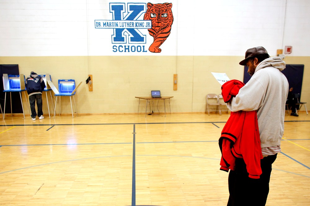 A man goes over his ballot at the Martin Luther King elementary school on November 6, 2012 in Milwaukee, Wisconsin.
