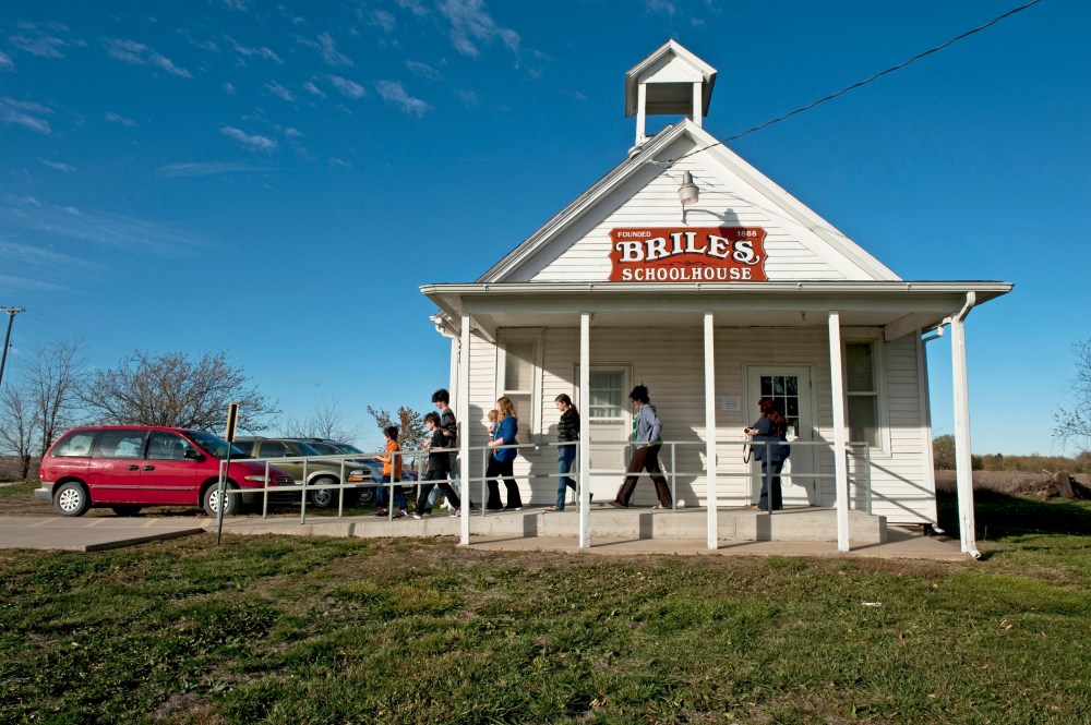 The Eads family leaves after watching their mother Suzie Eads vote at Briles Schoolhouse on November 5, 2012 in Wellsville, Kansas.