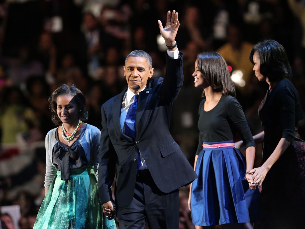 U.S. President Barack Obama walks on stage with first lady Michelle Obama and daughters Sasha and Malia to deliver his victory speech on election night at McCormick Place November 6, 2012 in Chicago, Illinois. Obama won reelection against Republican...